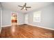Spacious living room features hardwood floors and connects to the kitchen through a doorway at 3203 Valleydale Rd, Monroe, NC 28110