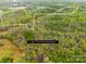 Aerial shot of the property showing lot lines in a densely wooded area, great for recreational opportunities at 322 S Main St, Shelby, NC 28152