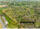 Aerial perspective of property illustrating lot lines among trees with recreational potential at 322 S Main St, Shelby, NC 28152
