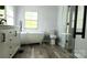 Modern bathroom featuring a soaking tub, walk-in shower, and a stylish vanity at 3325 Stony Brook Cir, Newton, NC 28658