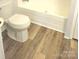 Bathroom featuring modern toilet and tub at 3325 Stony Brook Cir, Newton, NC 28658