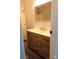 Bathroom vanity featuring natural wood cabinets and a white countertop at 3325 Stony Brook Cir, Newton, NC 28658