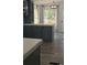 Modern kitchen featuring gray cabinets with white countertops, wooden style floors and stainless steel appliances at 3325 Stony Brook Cir, Newton, NC 28658