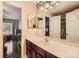 Bathroom featuring a vanity with dual mirrors, single sink and walk-in closet at 3420 Caldwell Ridge Pkwy, Charlotte, NC 28213