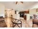 Open-concept living room featuring a fireplace, tile floors, and views of the kitchen and staircase at 3420 Caldwell Ridge Pkwy, Charlotte, NC 28213