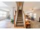 Inviting foyer features a staircase and glimpses of the living and dining areas, highlighting the home's open layout at 3901 Parkers Fry None, Fort Mill, SC 29715
