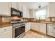 The stainless steel appliances and wood countertops add to the charm of this kitchen that has a tiled backsplash at 3901 Parkers Fry None, Fort Mill, SC 29715
