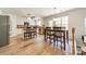 Bright, eat-in kitchen features an island with seating, wood floors, white cabinets and stainless steel appliances at 3901 Parkers Fry None, Fort Mill, SC 29715