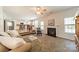 Open living room featuring a fireplace, neutral colors, and a view to the kitchen at 3901 Parkers Fry None, Fort Mill, SC 29715