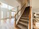 View of the entryway, staircase, and dining room featuring beautiful flooring and natural light at 3901 Parkers Fry None, Fort Mill, SC 29715