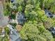 Aerial view of a home with mature trees and a well-maintained lawn in a residential area at 394 Runnymede Dr, Rock Hill, SC 29732