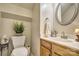 Charming half-bathroom features a stylish vanity, decorative mirror, and elegant fixtures at 394 Runnymede Dr, Rock Hill, SC 29732