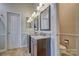 Bathroom featuring dual vanities with granite countertops and tile flooring at 394 Runnymede Dr, Rock Hill, SC 29732