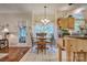 A dining room featuring a wood table and chairs near large windows with natural lighting at 394 Runnymede Dr, Rock Hill, SC 29732