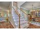 Inviting foyer showcasing a staircase with white railings and wood accents, leading to the upper level at 394 Runnymede Dr, Rock Hill, SC 29732