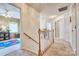 Upstairs hallway featuring carpeted floors, white trim, and a view of a playroom at 394 Runnymede Dr, Rock Hill, SC 29732