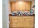 A well-organized butler's pantry featuring wooden cabinets and granite countertops at 394 Runnymede Dr, Rock Hill, SC 29732