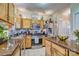 Traditional kitchen with wooden cabinets, granite countertops, and stainless steel appliances for a charming cooking space at 394 Runnymede Dr, Rock Hill, SC 29732
