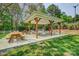 Covered outdoor seating area with picnic tables and chairs for residents' relaxation and social gatherings at 394 Runnymede Dr, Rock Hill, SC 29732