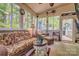 Cozy sunroom with large windows, wicker furniture, and natural light for relaxing and enjoying outdoor views at 394 Runnymede Dr, Rock Hill, SC 29732