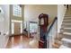 Bright foyer with hardwood floors, high ceilings, a staircase, and a grandfather clock at 4721 Myers Ln, Harrisburg, NC 28075
