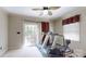 A home gym featuring exercise equipment, neutral walls and a view to the backyard at 4721 Myers Ln, Harrisburg, NC 28075