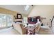 A cozy living room featuring a fireplace, comfortable seating, and natural lighting at 4721 Myers Ln, Harrisburg, NC 28075