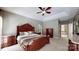 Elegant main bedroom with a tray ceiling, neutral decor, and an ensuite bathroom at 4721 Myers Ln, Harrisburg, NC 28075