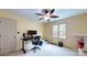 Bright office space with ceiling fan and large window, providing ample light for working from home at 4721 Myers Ln, Harrisburg, NC 28075