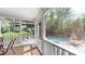 Inviting screened porch with views of a tranquil pool and beautifully landscaped backyard at 4721 Myers Ln, Harrisburg, NC 28075