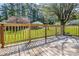 Wooden deck overlooking a green yard with mature trees, creating a tranquil outdoor space at 501 8Th Sw Ave, Conover, NC 28613