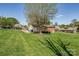 Spacious backyard showcasing a lush lawn, mature trees, and a classic home exterior at 501 8Th Sw Ave, Conover, NC 28613