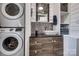 Updated bathroom features stacked washer/dryer, vanity with vessel sink, and shiplap walls at 501 8Th Sw Ave, Conover, NC 28613