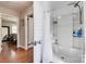 Bathroom featuring a combined tub and shower with white plank walls and stainless steel fixtures at 501 8Th Sw Ave, Conover, NC 28613