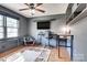 Office/bedroom features wood floors, a ceiling fan and a mounted television for convenience at 501 8Th Sw Ave, Conover, NC 28613