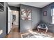 Bedroom features hardwood floors and neutral walls, with ensuite, closet and artwork at 501 8Th Sw Ave, Conover, NC 28613
