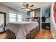 Spacious bedroom featuring a ceiling fan, large windows, and a bed with integrated storage drawers at 501 8Th Sw Ave, Conover, NC 28613