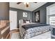 Well-lit bedroom with hardwood floors, a window, and stylish decor, offering a cozy and inviting atmosphere at 501 8Th Sw Ave, Conover, NC 28613