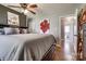 Bedroom with hardwood floors, unique decor, and an attached bathroom with a view of the toilet at 501 8Th Sw Ave, Conover, NC 28613