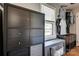 Well-organized closet featuring built-in storage, shelving, and a window with natural light and hanging clothes at 501 8Th Sw Ave, Conover, NC 28613
