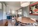 Cozy dining room with open view to the kitchen has hardwood floors and a modern light fixture at 501 8Th Sw Ave, Conover, NC 28613