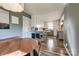 Open concept eat-in kitchen and dining room with wood floors and plenty of natural light at 501 8Th Sw Ave, Conover, NC 28613