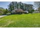 Charming front yard with a lush lawn and blooming trees adding a vibrant touch at 501 8Th Sw Ave, Conover, NC 28613