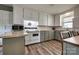 Bright kitchen featuring updated cabinets, butcher block countertops, and modern appliances at 501 8Th Sw Ave, Conover, NC 28613