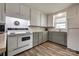 Well-lit kitchen with white and gray cabinetry, butcher block countertops, and modern appliances at 501 8Th Sw Ave, Conover, NC 28613