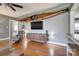 Cozy living room has unique décor and TV, all accented by the warm hardwood floors at 501 8Th Sw Ave, Conover, NC 28613