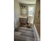 Updated bathroom with modern vanity, lighting, toilet, and tub with marbled tile surround at 510 S Yadkin Ave, Spencer, NC 28159