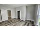 Comfortable bedroom featuring modern wood-look flooring, and ample closet space at 510 S Yadkin Ave, Spencer, NC 28159