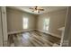 Bright bedroom featuring wood-look flooring and large windows allowing for natural light at 510 S Yadkin Ave, Spencer, NC 28159