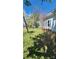 Landscaped yard with lush grass and mature trees, offering a serene and inviting outdoor space at 510 S Yadkin Ave, Spencer, NC 28159